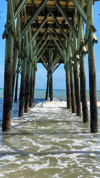 Under the Pier and Atlantic Ocean in Myrtle Beach South Carolina