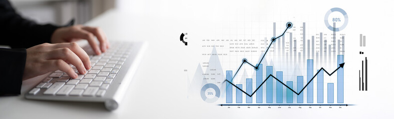 Hands actively engage with a keyboard, paired with dynamic graphs and statistics on a digital...