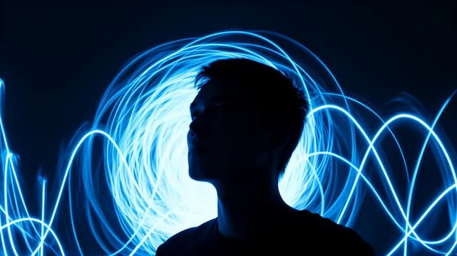 long exposure style glowing lines swirling around silhouette head shape, dark background, vibrant electric blues, conceptual thought process, perfect for World Logic Day