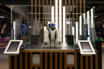 robot salesman. smart hotel in hospitality industry 4.0 concept, receptionist robot robot assistant in lobby of hotel, airports always welcome customer service is including room, information provision