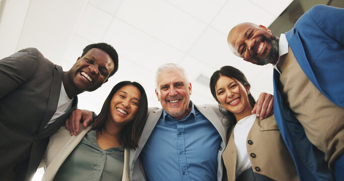 Business portrait, team and happy with hug at law firm for office community, solidarity or about us. Low angle, lawyer staff and smile with embrace for legal collaboration, career integrity and pride
