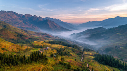 Aerial view of misty mountains and rice terraces at sunrise