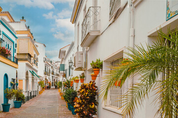 Charming, flower-bedecked street in Estepona, Spain in early  Spring