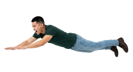 Dynamic full body shot of a young man in mid-air, outstretched arms and shouting with