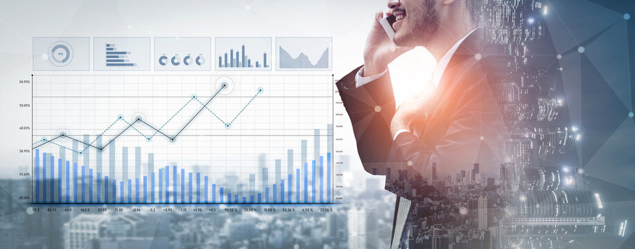 A business professional engages in a phone conversation while analyzing financial data displayed on digital graphs, showcasing the fusion of technology and finance in modern business. Scalp