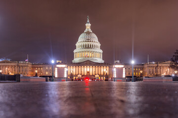 Fototapeta premium Washington DC captured at dusk. Illuminated US Capitol at night. Night view of the Washington Capitol building. Iconic Capitol building. United States Congress building.