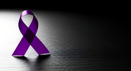 Purple ribbon on dark wood