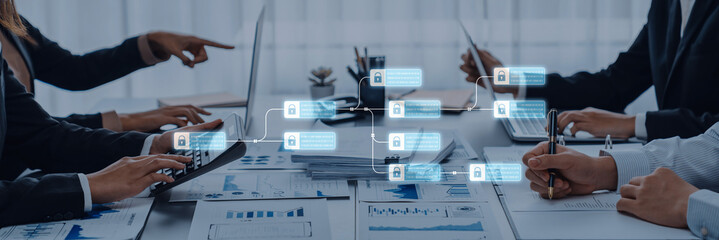 A dynamic business meeting scene showcasing a team engaged in data analysis and discussion, leveraging technology and documents to drive collaborative decision-making. Trope