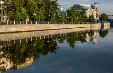 A long concrete embankment along the river.