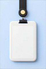 Close-up of a blank white ID badge with a black lanyard, hanging against a light blue background. The badge is empty, ready for personalization.