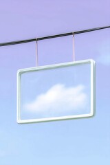 A rectangular clear sign is hanging from a wire with a cloud inside it against a gradient blue sky.