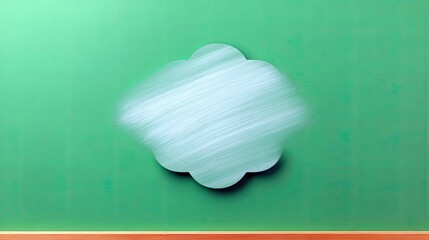 A cloud-shaped design on a textured green wall, with a wooden base.