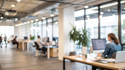 People working in an open office space during the day