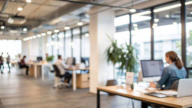 People working in an open office space during the day