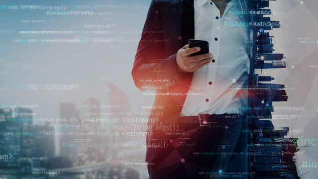 A business professional in formal attire uses a smartphone, surrounded by a city skyline and an overlay of digital data, illustrating modern technology and connectivity in urban life. Xenic