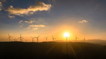 Panoramic view of wind farm or wind park, with high wind turbines for generation electricity with copy space. Green energy concept, Quang Tri, Vietnam