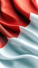 A close-up shot of the Canadian flag waving. The flag features a red field with a white square in the center, and a red maple leaf in the center of the white sq
