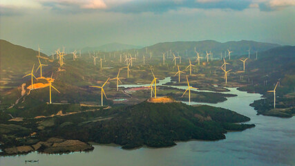 Wind farm on the mountain, blue sky and white clouds, sun at Huong Linh, Quang Tri, Vietnam