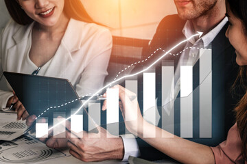 A collaborative team discusses data analysis and business growth strategies in a modern office environment, showcasing professional engagement and innovation. Impute