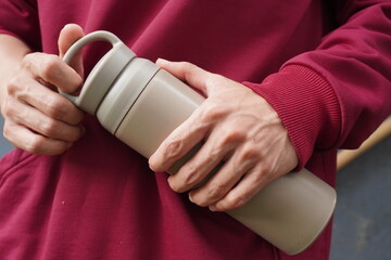 Man holding tumbler