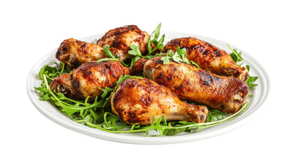 A plate of chicken with green leaves 