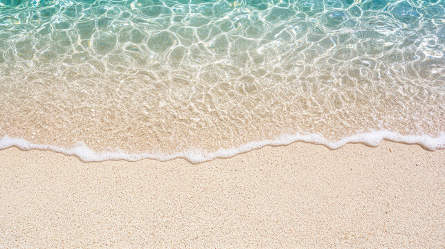 Shallow clear water sandy beach gentle wave shoreline sea foam turquoise water summer coastal