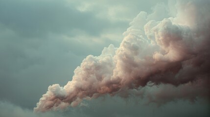 A large cloud of smoke is rising from the ground. The sky is cloudy and grey, and the smoke is billowing out of the clouds. The scene is ominous and foreboding