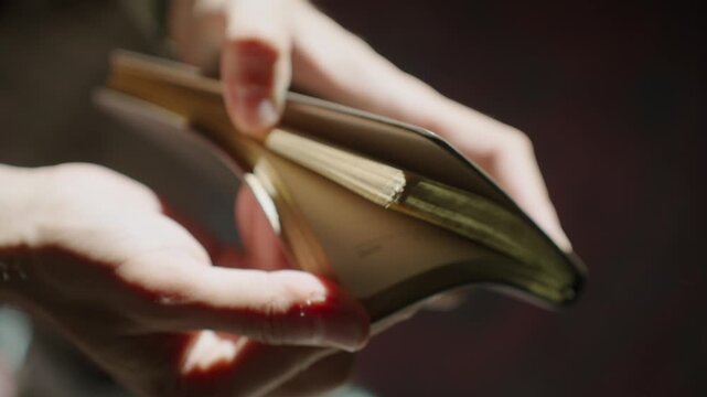 Hands holding open book, highlighting reflection and contemplation