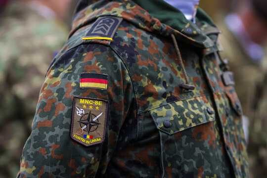 Patch on the uniform of a German soldier preparing to attend the Romanian National Day military parade.