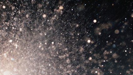 Abstract, glittering particles against a dark background