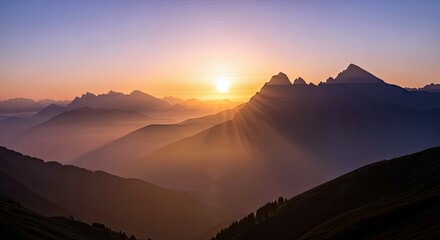 A breathtaking landscape photograph of mountain ranges silhouetted against a vibrant sunrise, with golden light and atmospheric perspective.