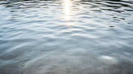 Calm water reflection sunlight ripples serene glow