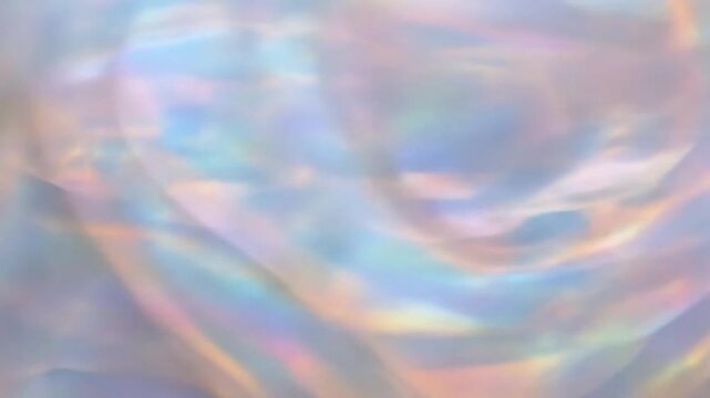 A beautiful opal-like crystal texture with shifting light diffusion creating an iridescent abstract motion.