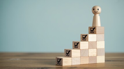 Wooden figure stands atop a staircase of blocks marked with successful achievement symbols