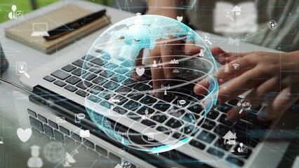 A close-up image of hands typing on a laptop keyboard with a translucent globe overlay, symbolizing digital networking, communication, and technology integration. Xenic