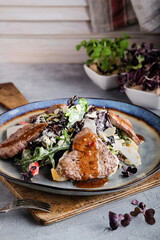 Comforting gourmet meal displayed on textured ceramic surface