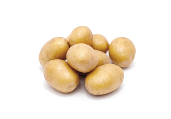 Heap of raw baby potatoes on white background