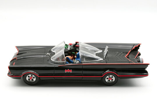 Bologna - Italy - November 11, 2025: Batmobile plastic model car by Aurora, from the iconic Batman 1966 television series, isolated on white.