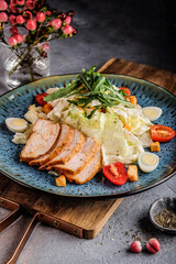 Sliced pork loin with cabbage slaw — bistro dinner plate