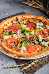 Natural light captures vibrant organic vegetable pizza on ceramic dish