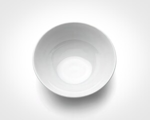 Simple white ceramic bowl viewed from above on a white background