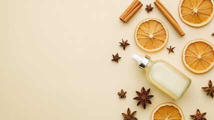 Flat lay of a cosmetic serum dropper bottle with dried orange slices, cinnamon sticks, and star anise on a beige background.