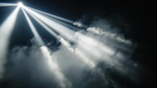 Abstract view of intense white light beams penetrating thick atmospheric fog in a dark environment demonstrating highly variable opacity and ethereal movement penetrating, presentation, atmospheric