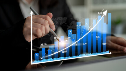 Captivating image of a business professional analyzing a bar graph illustrating growth trends, showcasing data-driven insights and strategic planning in an office setting. Tessel