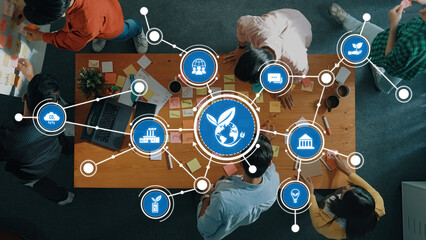 A dynamic workspace featuring a team collaborating on green innovation strategies, utilizing visual aids for sustainable business development and impactful solutions. Amity