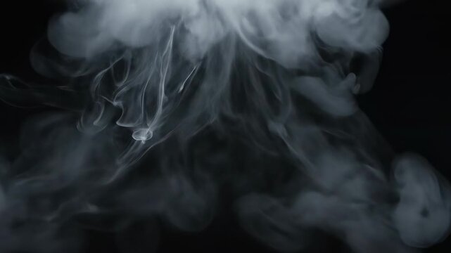 Extremely slow motion clip of thick white smoke dissipating and dissolving into a dark empty background, suitable for overlay effects or organic opacity transitions white, cinematic, steam