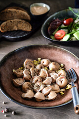 Rustic ceramic dish features fragrant mushroom pasta blend