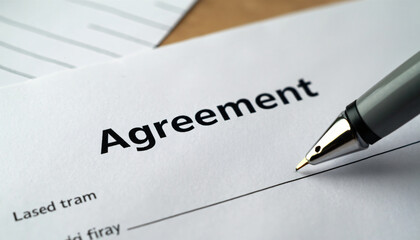 Document with "Agreement" Text and Pen