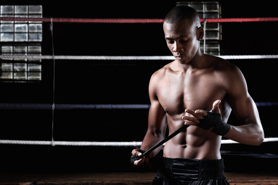 Boxer, black man and hand wrap for sports, training preparation and fitness in gym. Boxing, shirtless person and tape to get ready for fight, workout or protection with equipment for safety in ring