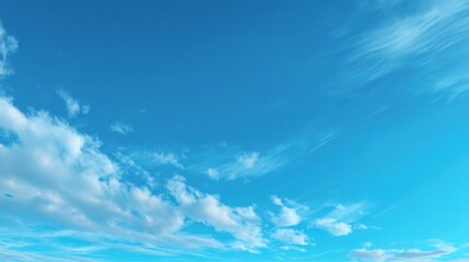 A clear blue sky with a few clouds. The sky is so clear that it looks like a painting